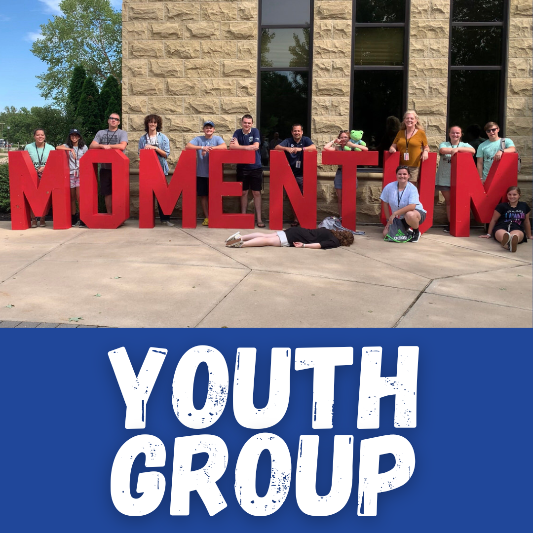 Grace Groups Youth Group at Momentum - having their picture taken with the human-sized Momentum letters.